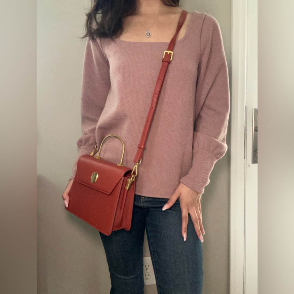 Pink Sweater with Red Handbag